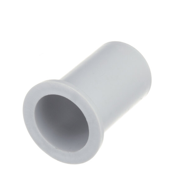 A close-up of a white plastic pipe with a hole.