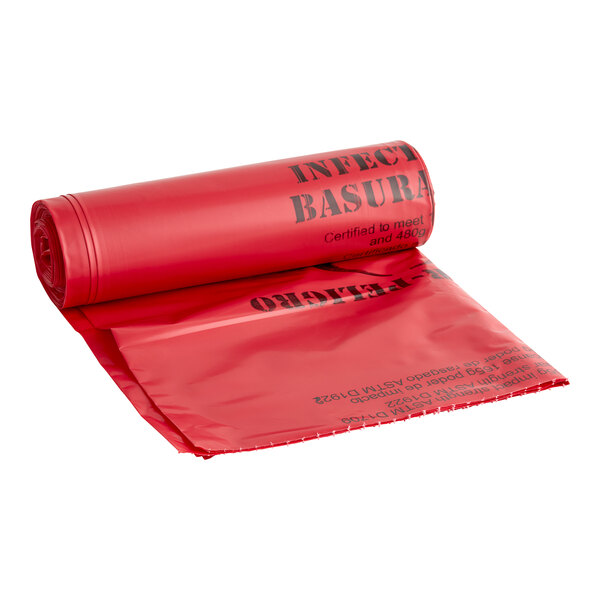 A red roll of 44 gallon low density plastic garbage bags with black text.