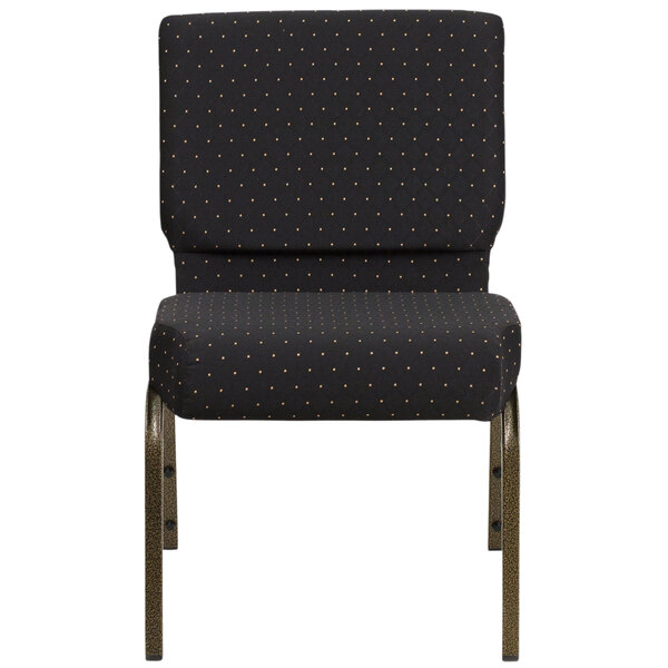 A black church chair with gold legs and a polka dot pattern.
