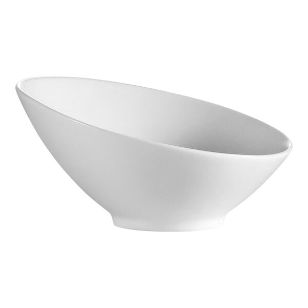 A CAC bone white porcelain bowl with a curved bottom.