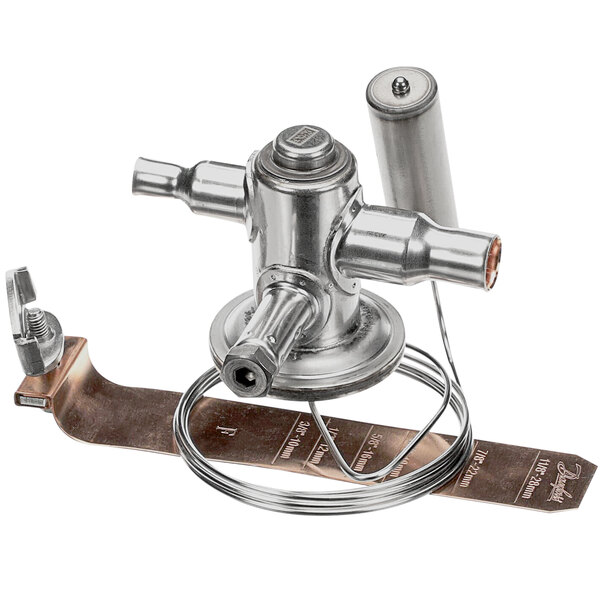 A silver metal Glastender expansion valve with 3 orifices.