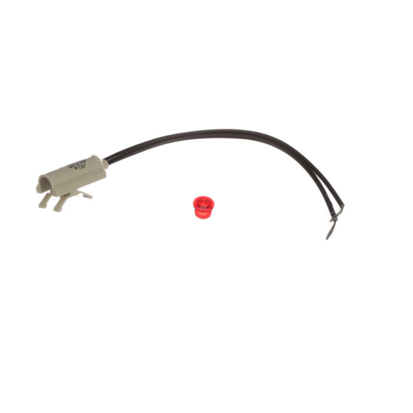 A close-up of a Caddy round red signal light with a black tube and red cap over a wire.