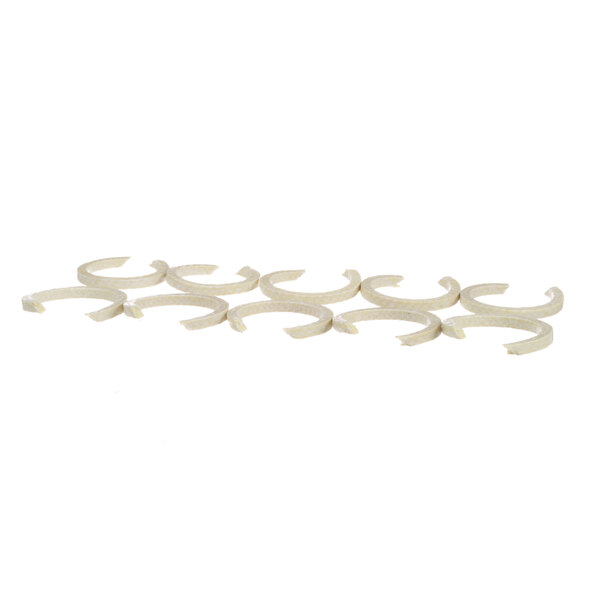 A group of ten white plastic Groen packing rings.