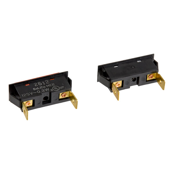 Two rectangular black electrical components with gold-colored metal terminals, viewed from different angles, with one showing printed specifications on its surface.
