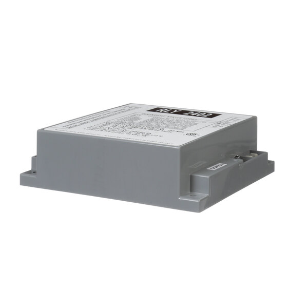 A grey rectangular Lochinvar ignition module with a white label.