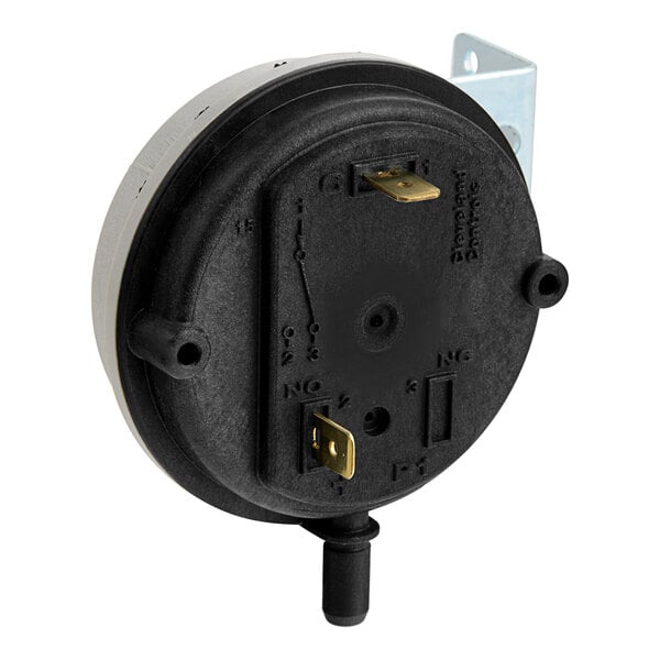 A round black Cleveland Air Prover switch.