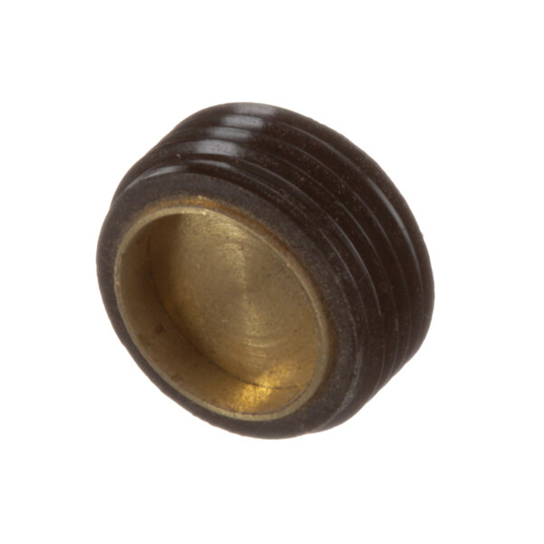 A close-up of a black and gold threaded cap brush wheel.