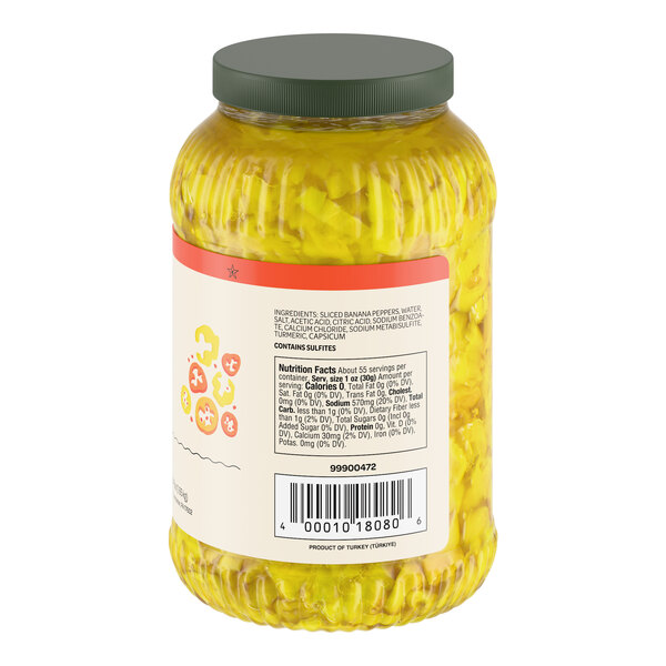 A large plastic jar filled with sliced hot banana pepper rings and sealed with a green lid.