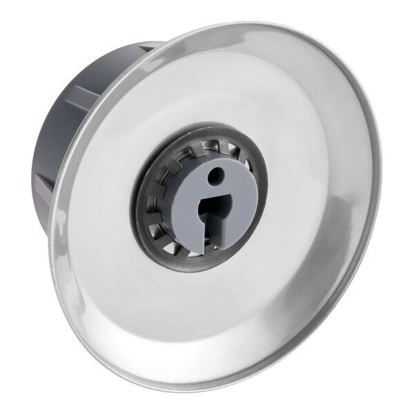 A metallic and plastic control knob with a circular, reflective face and a central gray insert featuring a keyhole-shaped slot.