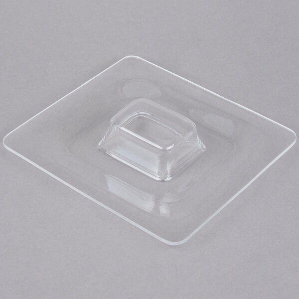 A clear plastic lid for a square food pan.