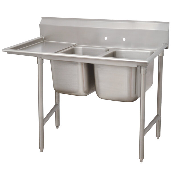 A stainless steel Advance Tabco two compartment pot sink with left drainboard.