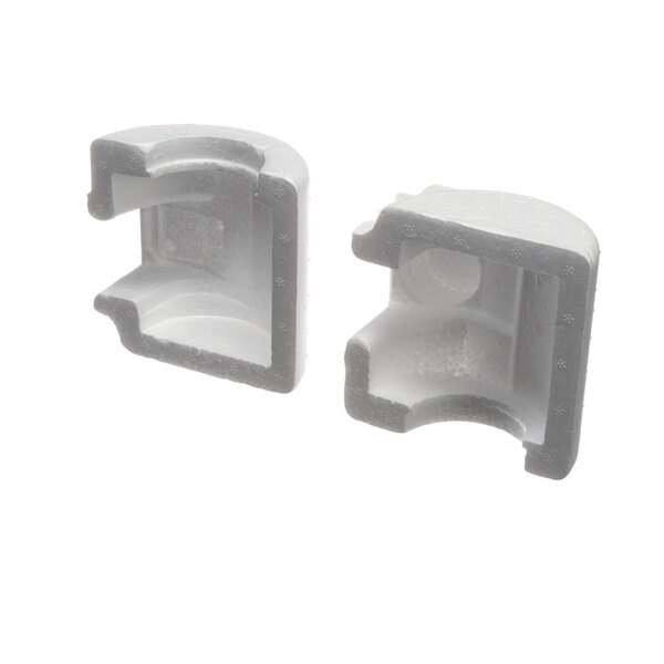 A pair of white polystyrene corners.