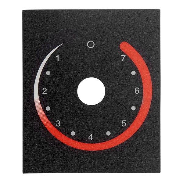 A black circular switch plate with red and white indicators.