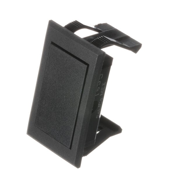 A black plastic square with a metal clip.