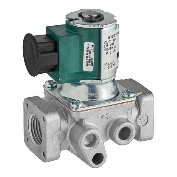 A close-up of the metal Imperial 1134 solenoid valve with a green button.