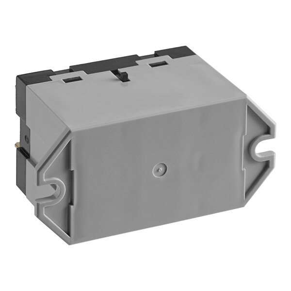 A grey rectangular Frymaster relay with a black cover on top with black and white buttons.