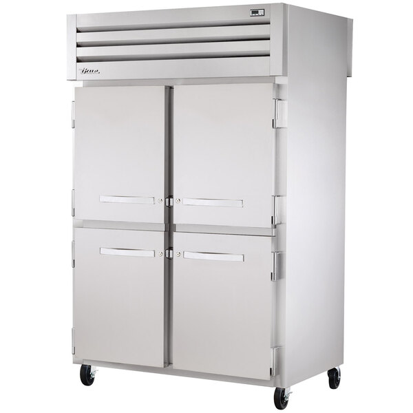 A white rectangular True refrigerator with four doors.