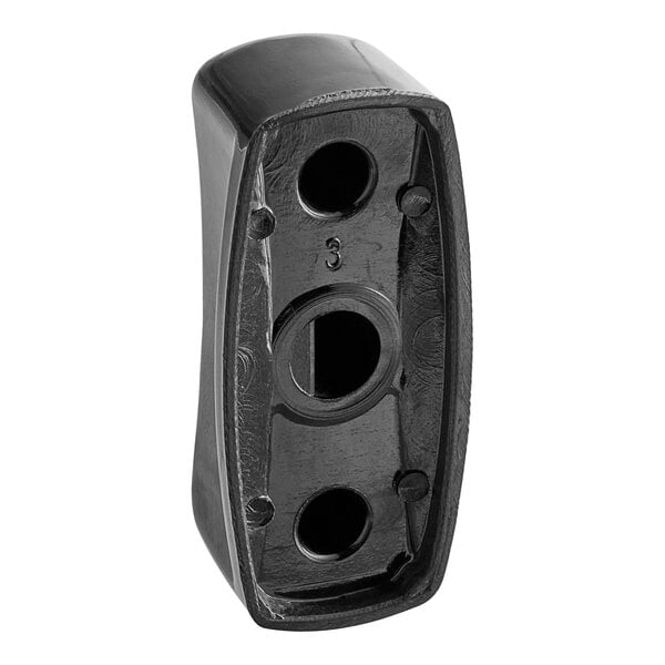 A black plastic Garland range knob with holes in it.