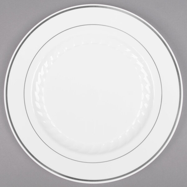 A Fineline white plastic plate with silver bands.