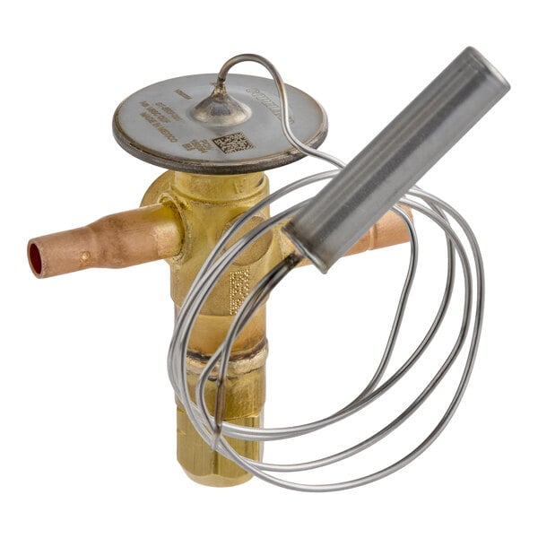 A brass valve with copper pipe connections and an attached coiled metal sensor tube.