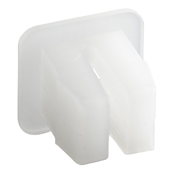 A white plastic Scotsman catch screw with a square hole.