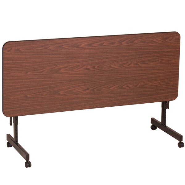 A brown rectangular Correll EconoLine mobile table with wheels.