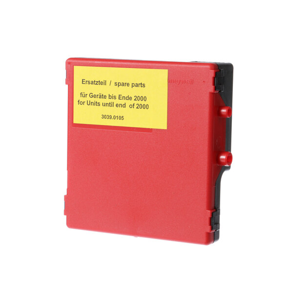 A red Rational gas ignition module with a yellow label.