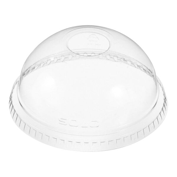 A clear plastic dome lid with a hole in it.