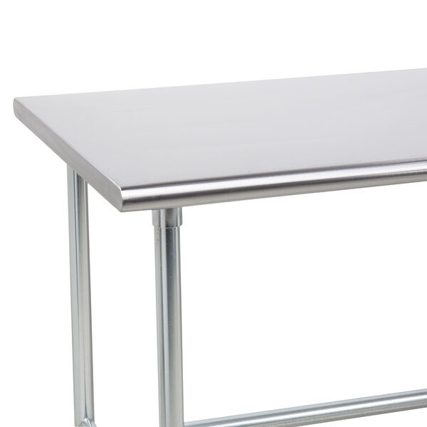 A stainless steel Advance Tabco work table with an open metal base.