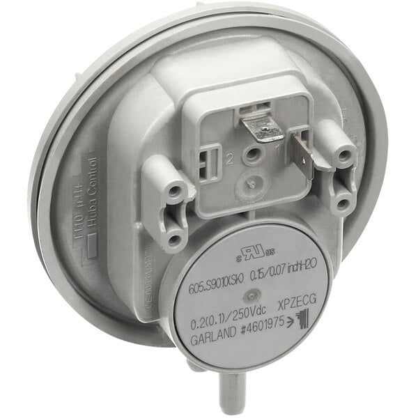 A white pressure switch with a metal cover on a round base.
