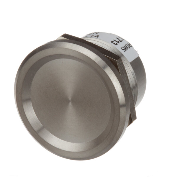 A round stainless steel Champion piezo switch button.