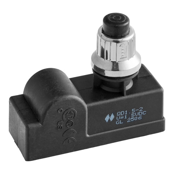 A black and silver spark ignitor for commercial kitchen equipment.