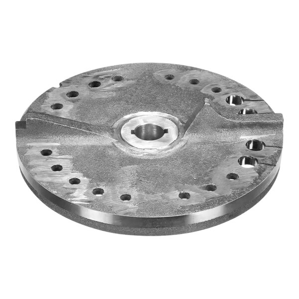 A close-up of the InSinkErator Rotating Shredder Assembly, a circular metal plate with holes.