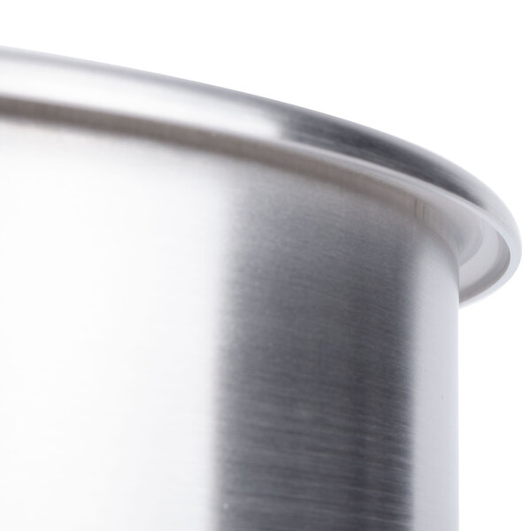 A close-up of a stainless steel bowl assembly for a Robot Coupe commercial food processor.