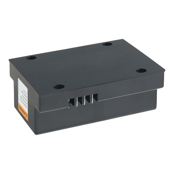 A rectangular black ignition module control unit with four visible metal prongs and mounting holes.