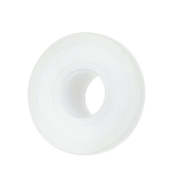 A white plastic bushing with a hole.