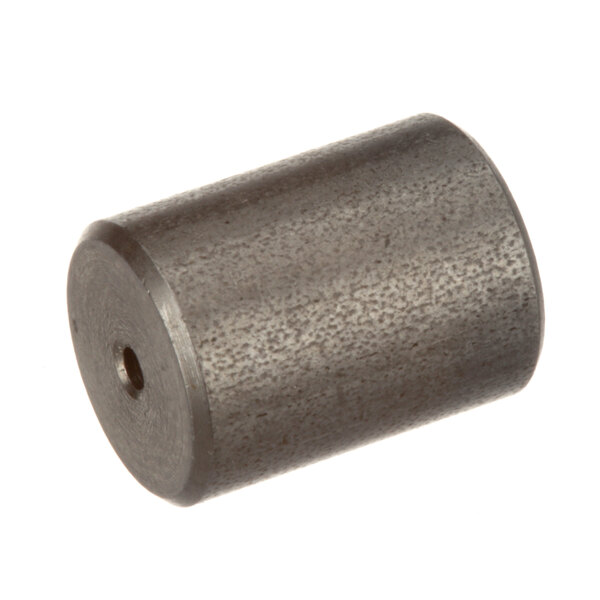 A close-up of a Groen Flow Restrictor, a metal cylinder with a black finish.