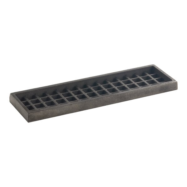A rectangular metal grate with a grid pattern.