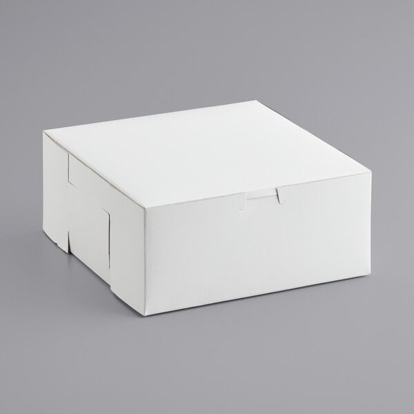 A 9" x 9" x 4" white cake box with a lid.