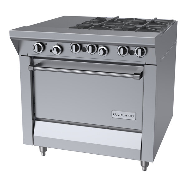 A commercial stainless steel gas range with four burners, an even heat hot top, and a standard oven.