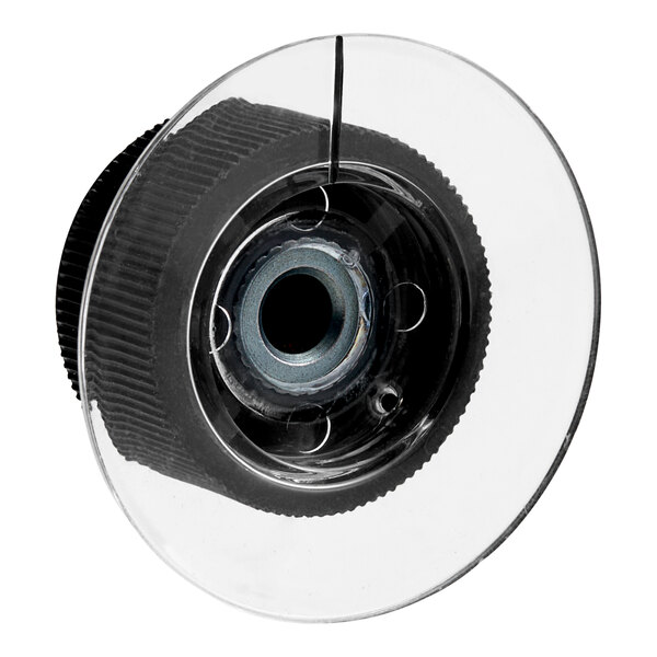 A black and white circular knob with a hole in it.