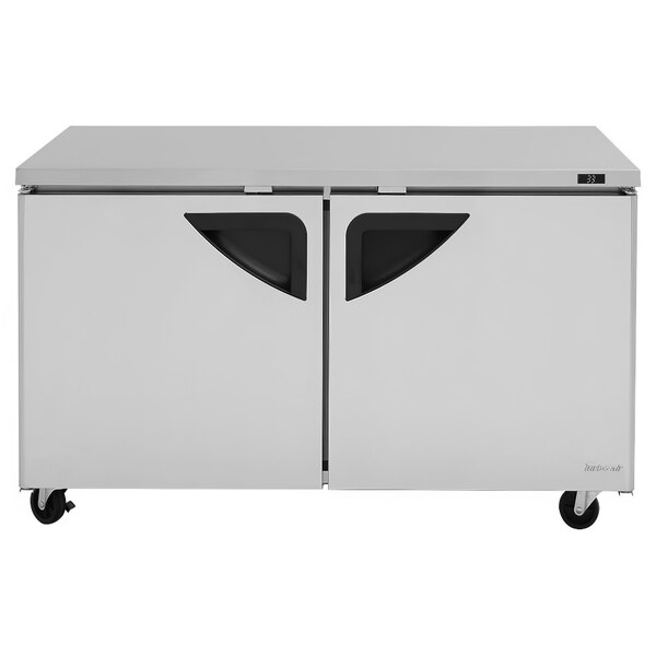 A white Turbo Air undercounter refrigerator with black handles.