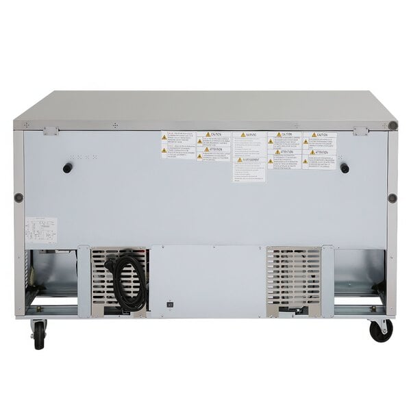 The back of a Turbo Air white metal undercounter refrigerator with a black cord.