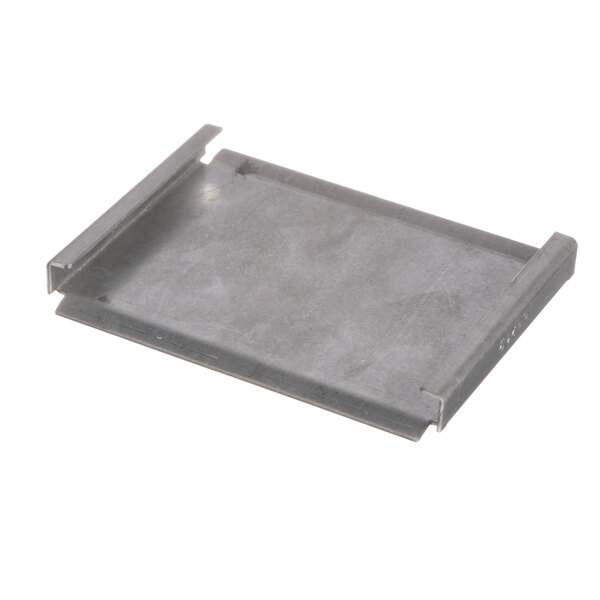 A grey metal Middleby Marshall blank plate with a hole in it.
