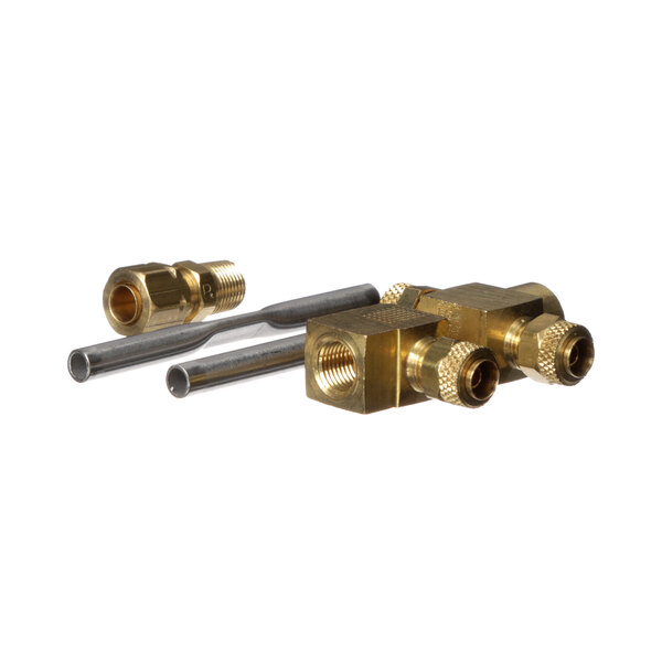 A brass Antunes water valve with two pipes and a hose.