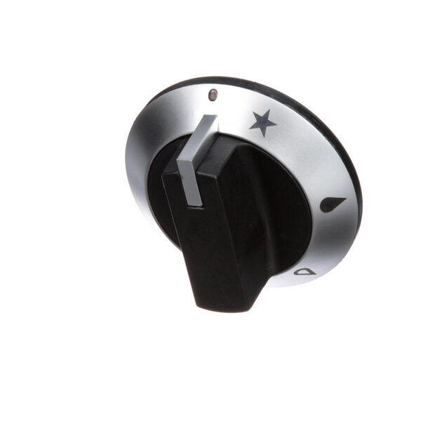 A close-up of a black and silver knob with a star on it.