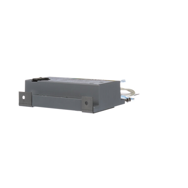 A Henny Penny ignition module, a small grey electronic box with wires.