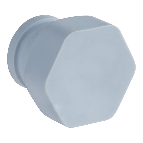 A white hexagon shaped Hobart wash arm plug.