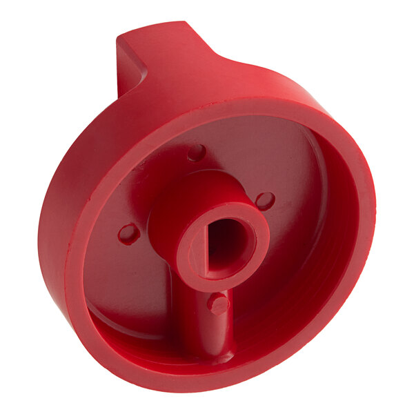 A red plastic Vulcan gas valve knob with a hole.