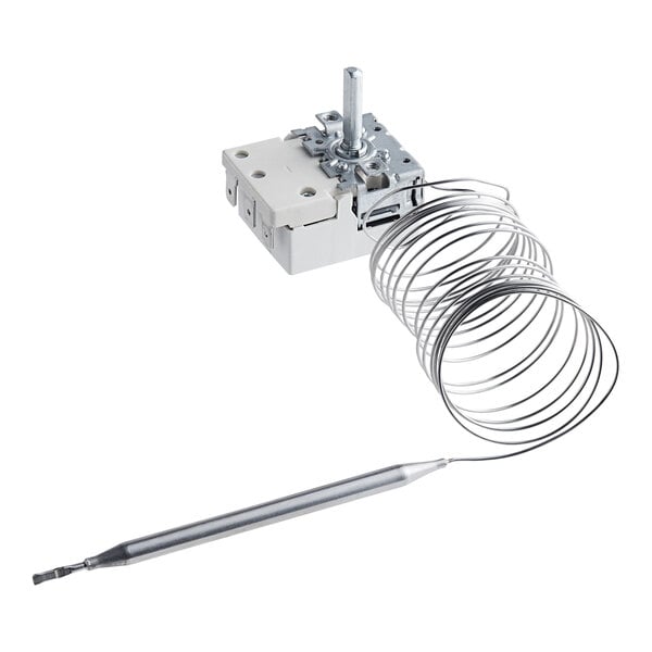 A small metal coil with a metal wire attached.